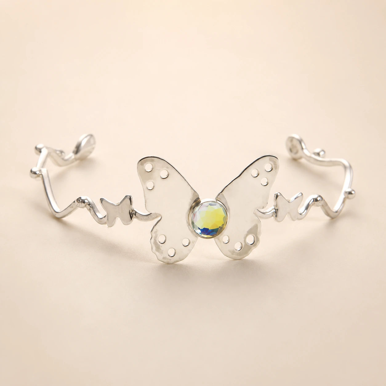Delicate silver butterfly necklace with an iridescent center stone