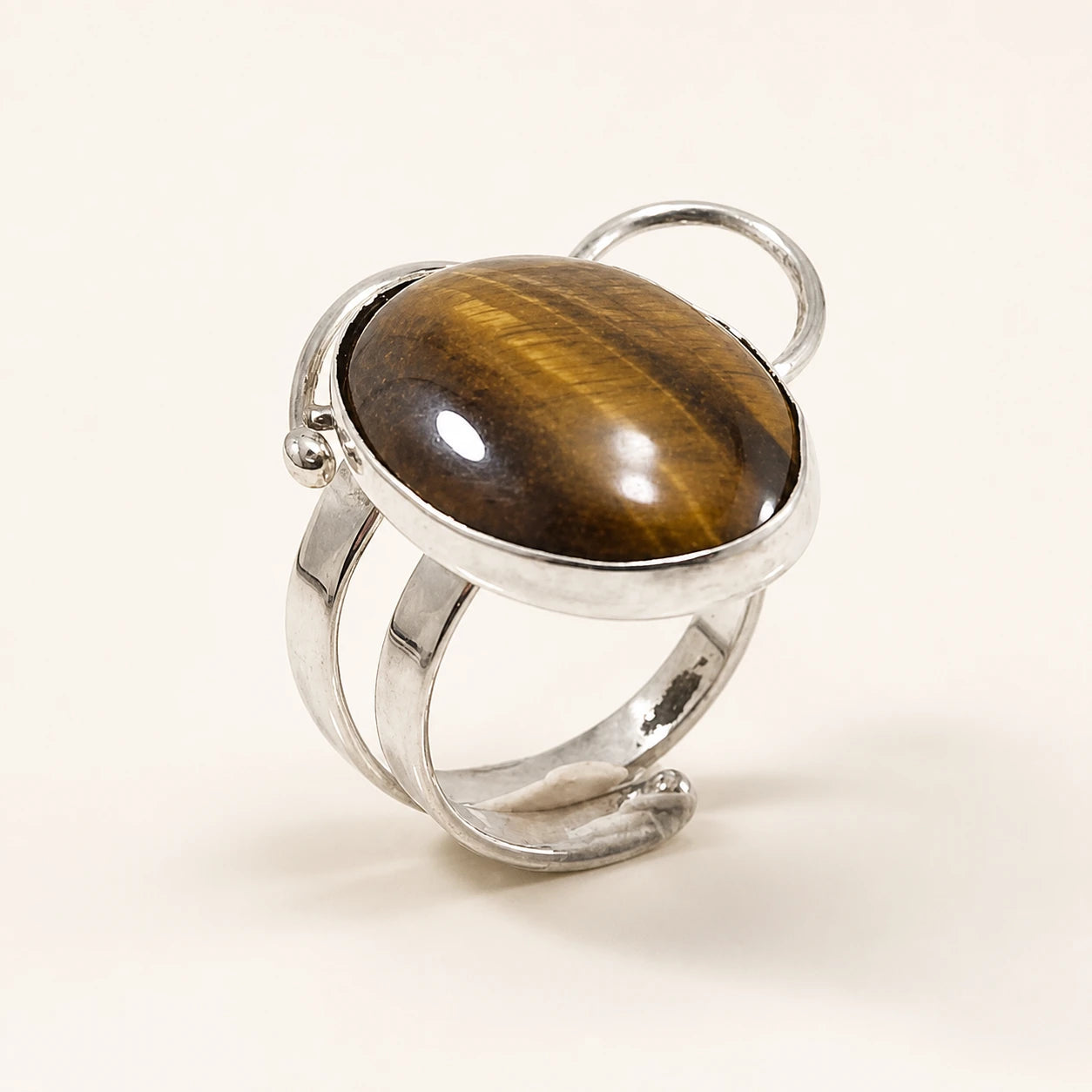 Sculptural silver ring with a warm brown oval stone